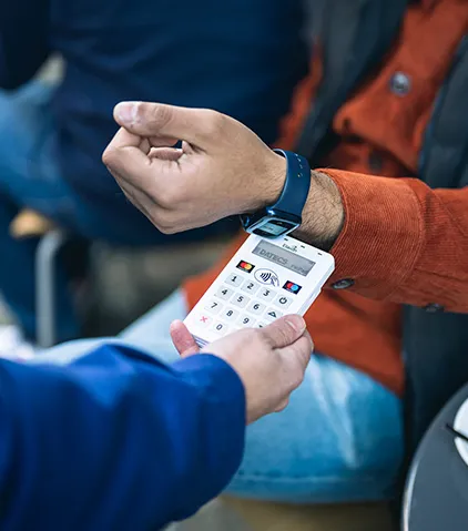 Contactless card payment being processed on a handheld card reader