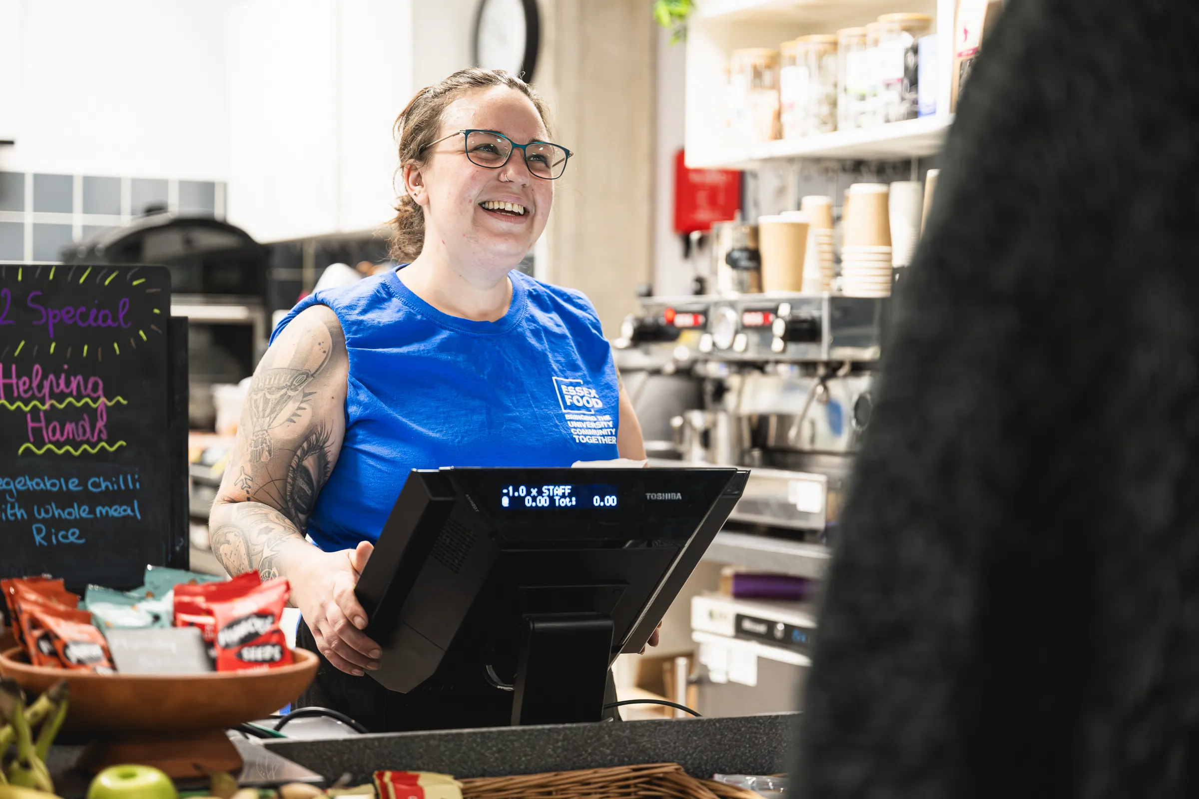 Nikaela Charman serving a customer