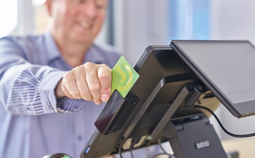 Pete Collette processes a payment transaction on Aspen Payments system